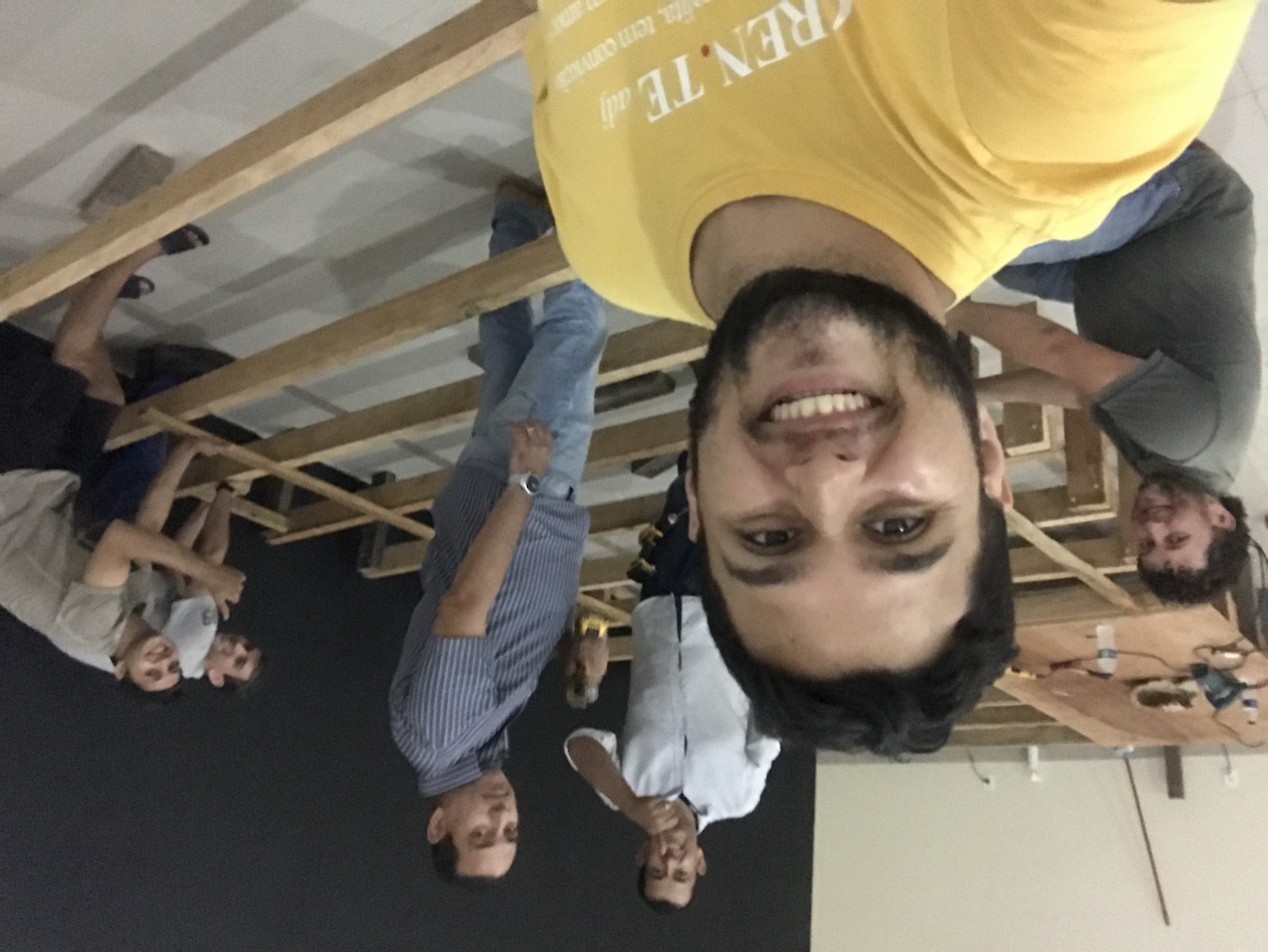 Daniel with volunteers building a wooden stage