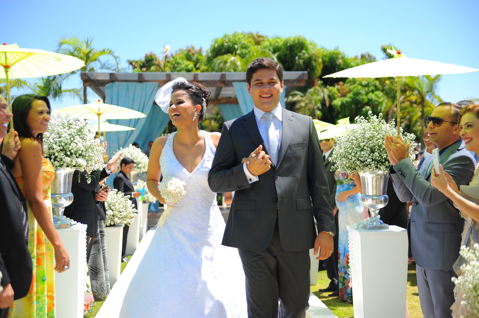 Daniel and Carla walking out after their wedding